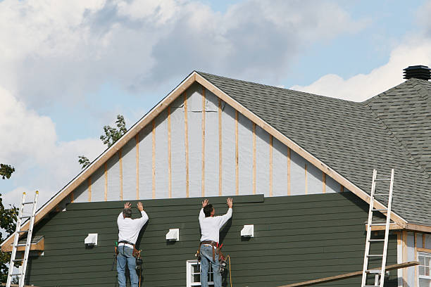 Professional Siding technician working in Auburn, NY
